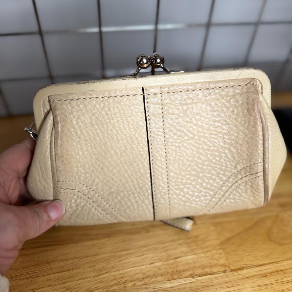 Coach Cream Leather Wristlet with Pebbled Texture and Metal Clasp